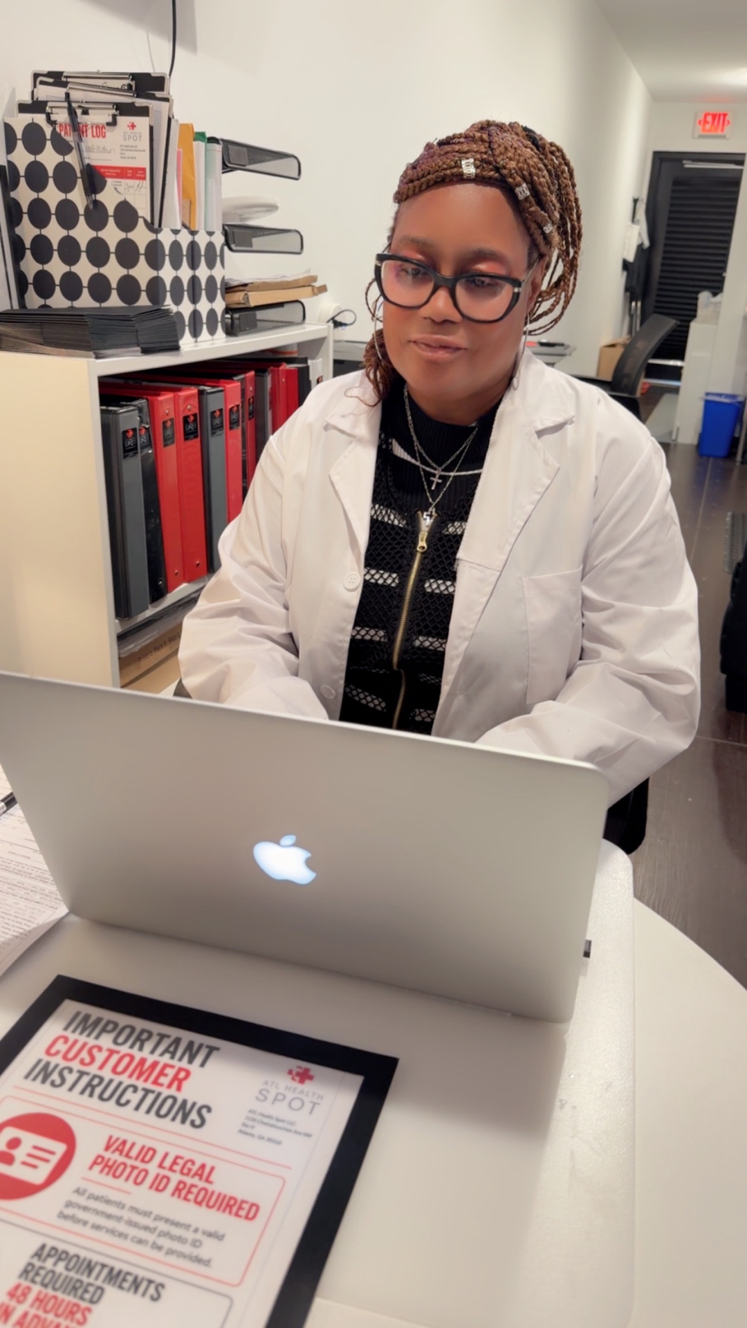 Wylene D. Calhoun, Administrative Manager at ATL Health Spot, working at the front office